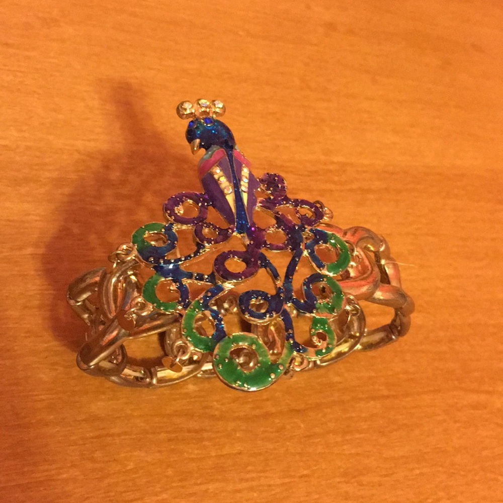 Golden peacock bracelet by designer Betsey Johnson